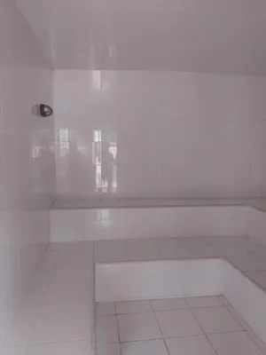 a white room with a bench and a light on it at Relax West Finca Hotel in Santa Fe de Antioquia
