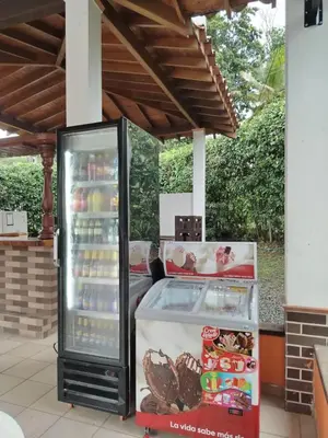 an open refrigerator with food inside of it at Relax West Finca Hotel in Santa Fe de Antioquia