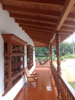 a porch with a swing and a hammock at Relax West Finca Hotel in Santa Fe de Antioquia