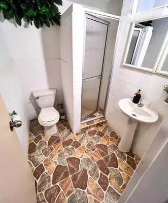 a bathroom with a toilet and a sink at Casa La Morada in Medellín
