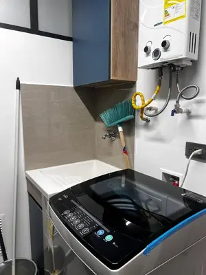 a kitchen with a stove top oven in a kitchen at Loft Belén WiFi900Mb Av 33 Cr 70 l Balcón Vista in Medellín