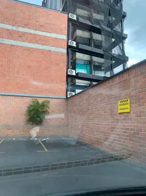 a brick wall with a building on top of it at Best location in El Poblado y Provenza in Medellín