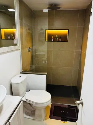 a bathroom with a toilet and a shower at Best location in El Poblado y Provenza in Medellín