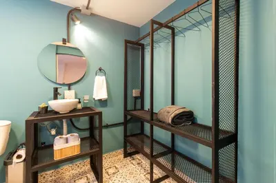 a bathroom with a sink and a mirror at P202 4BR Poblado Apartment at Poblado Provenza in Medellín