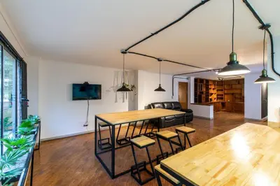 a living room with a table and chairs at P202 4BR Poblado Apartment at Poblado Provenza in Medellín