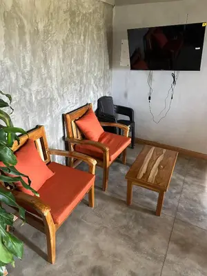 three chairs and a coffee table in a room at Finca El Encanto in Jericó