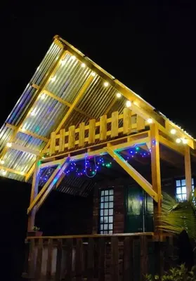 a house with a deck with lights on it at Mirador del valle in San Rafael