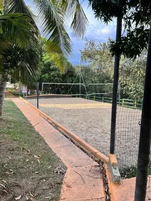 a tennis court with a net on a tennis court at Cabaña San Jerónimo in San Jerónimo