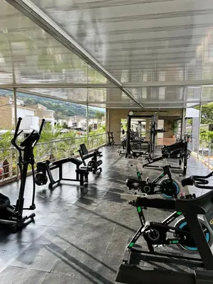 a gym with a bunch of exercise bikes in it at Cabaña San Jerónimo in San Jerónimo