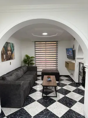 a living room with a couch and a table at Hermoso,amplio y central apartamento en Medellin in Medellín