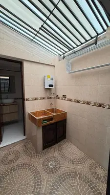 a bathroom with a wooden sink and a window at Hermoso,amplio y central apartamento en Medellin in Medellín