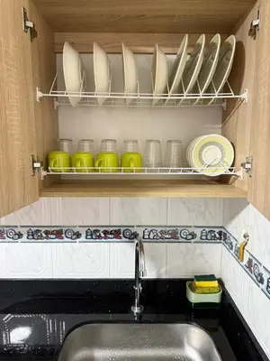 a kitchen with a sink and a shelf with dishes at Hermoso,amplio y central apartamento en Medellin in Medellín