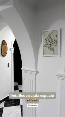 a hallway with an archway and a picture on the wall at Hermoso,amplio y central apartamento en Medellin in Medellín