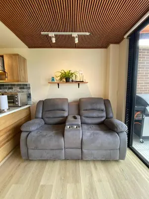 a leather couch sitting in a living room at San Telmo - Guatape with Hot Tube in Guatapé