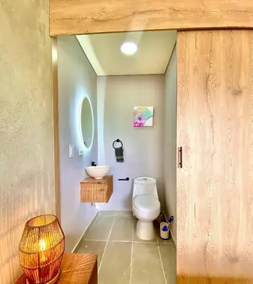 a bathroom with a toilet and a sink at San Telmo - Guatape with Hot Tube in Guatapé