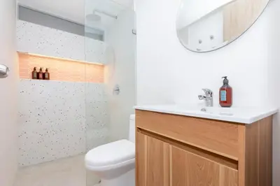 a bathroom with a toilet and a sink and a shower at Cozy Apt 4 -Laureles -AC- Smart Lock in Medellín