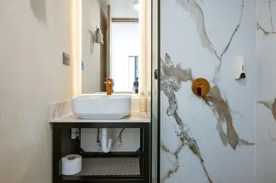 a bathroom with a sink and a shower at M301 Poblado Apt close to lleras park jacuzzi AC in Medellín