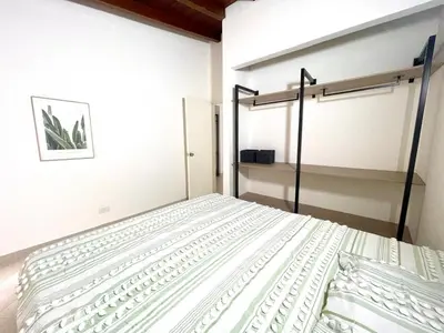 a bedroom with a bed in a room at R301 Apartment close to Lleras park and Provenza in Medellín