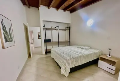 a bedroom with a bed in a room at R301 Apartment close to Lleras park and Provenza in Medellín