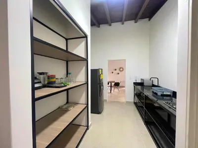 a kitchen with a refrigerator in a room at R301 Apartment close to Lleras park and Provenza in Medellín