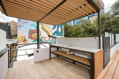 a bathroom with a sink and a large window at L301 4BR Lleras Park Apt Rooftop Jacuzzi AC in Medellín