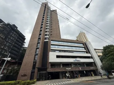 a tall building with people standing outside of it at SF501 Poblado Manila KBed Parking 247 security in Medellín