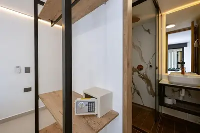 a bathroom with a sink and a microwave on a shelf at M501 Poblado Apt close to lleras park jacuzzi AC in Medellín