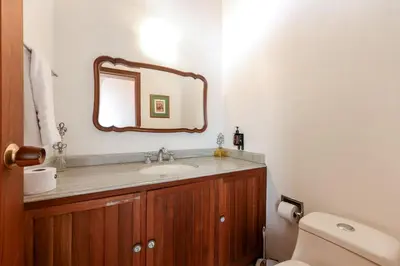 a bathroom with a sink and a mirror at CH51 Colonial Charm Villa at El Poblado Jacuzzi in Medellín