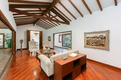 a living room with a couch and a table at CH51 Colonial Charm Villa at El Poblado Jacuzzi in Medellín