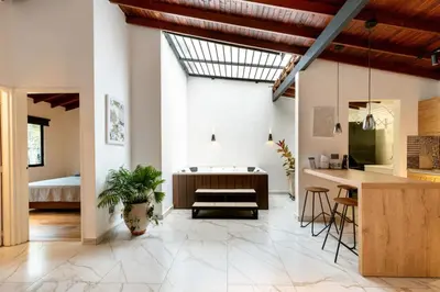 a kitchen and living room with a skylight at L2 2BR Laureles Apartment Jacuzzi AC in Medellín