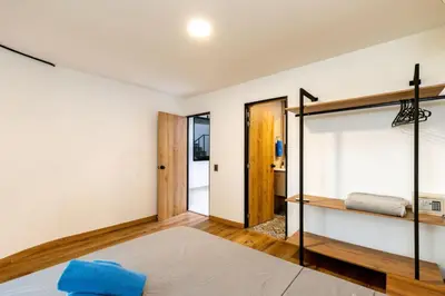 a bedroom with a bunk bed and a mirror at L1 7BR Laureles House rooftop jacuzzi AC in Medellín