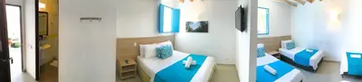two pictures of a room with a table and a room with blue at Hotel Aldea Plaza in Doradal