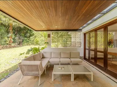 a living room with a couch and a table at CH65 Luxury 5BR Villa Jacuzzi Garden de Oro in Medellín