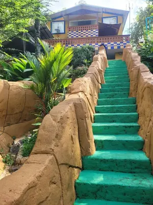 a set of stairs with green stones in front of a house at Cabaña Verdeazul in San Rafael