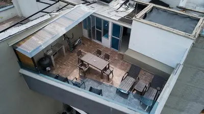 an overhead view of a patio with a table and chairs at Penthouse Stay & Relax Itagui in Itagüí