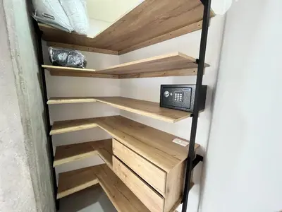 a walk in closet with wooden shelves at Edificio Aiana Verde by Host Medellin in Medellín