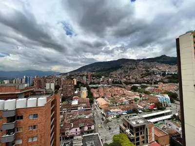 a view of a city with buildings and mountains at Edificio Aiana Verde by Host Medellin in Medellín