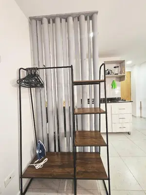 a metal radiator in a room with a ladder at Ágape 301 in Itagüí