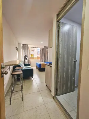 a room with a kitchen and a living room at Ágape 301 in Itagüí