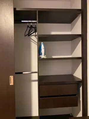 a closet with a shelf with a toy in it at Estancias confortables, amigos y familia in Manizales