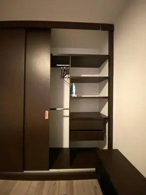 an empty closet with a refrigerator in a room at Estancias confortables, amigos y familia in Manizales