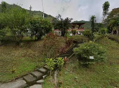 a set of stone steps leading up to a house at Hotel Estadero Piscina EL CACIQUE GUARKAMA in Montañadentro