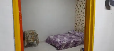 a small room with a bed in the corner at Hotel Estadero Piscina EL CACIQUE GUARKAMA in Montañadentro