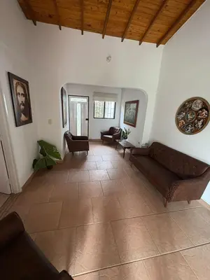 a living room with a couch and chairs at Casa San Antonio de Pereira in Rionegro