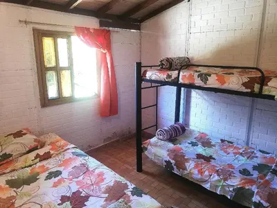 a room with two bunk beds and a window at Casa Arcolibri in San Rafael
