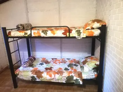 two bunk beds in a room with a bed at Casa Arcolibri in San Rafael