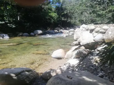 a stream with rocks in a river at Casa Arcolibri in San Rafael