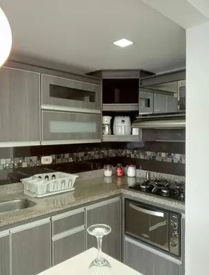 a kitchen with stainless steel appliances and a wine glass at Ap entero en Rionegro cerca Aiport JMC ,Int in Rionegro