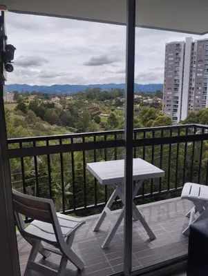 a white table and chairs on a balcony at Ap entero en Rionegro cerca Aiport JMC ,Int in Rionegro