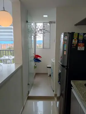 a kitchen with a black refrigerator and a window at Ap entero en Rionegro cerca Aiport JMC ,Int in Rionegro